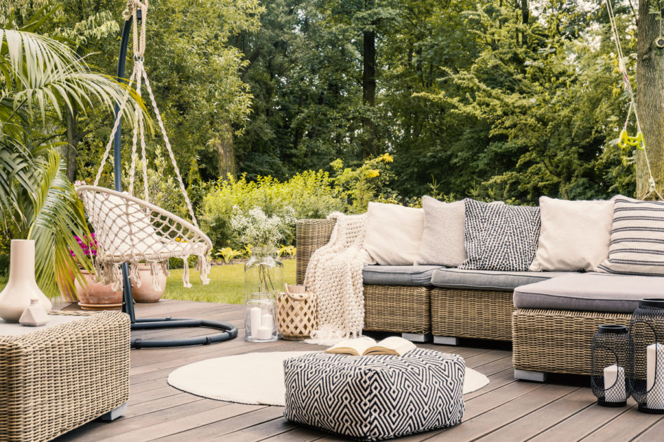 Patio set up with outdoor furniture and decorations