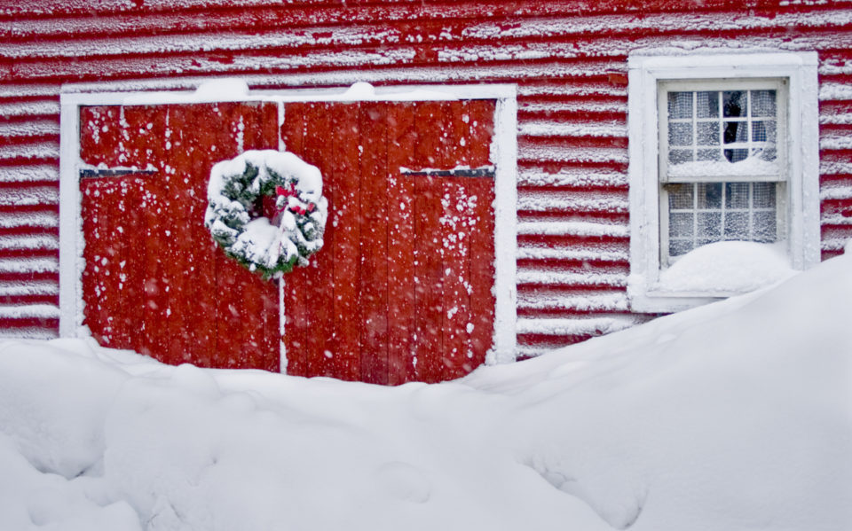 barn decorated for Christmas and snowed in