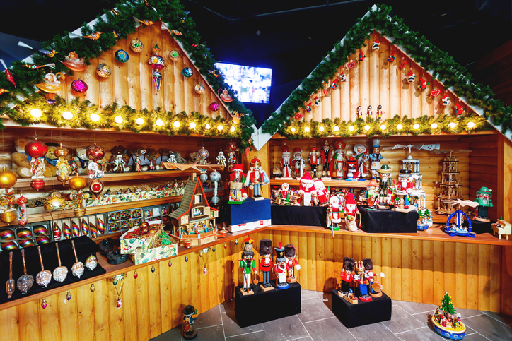Souvenir shop in Santa Claus village near Arctic circle. Many figures of Joulupukki and Nutcracker, Christmas decorations and light bulbs.